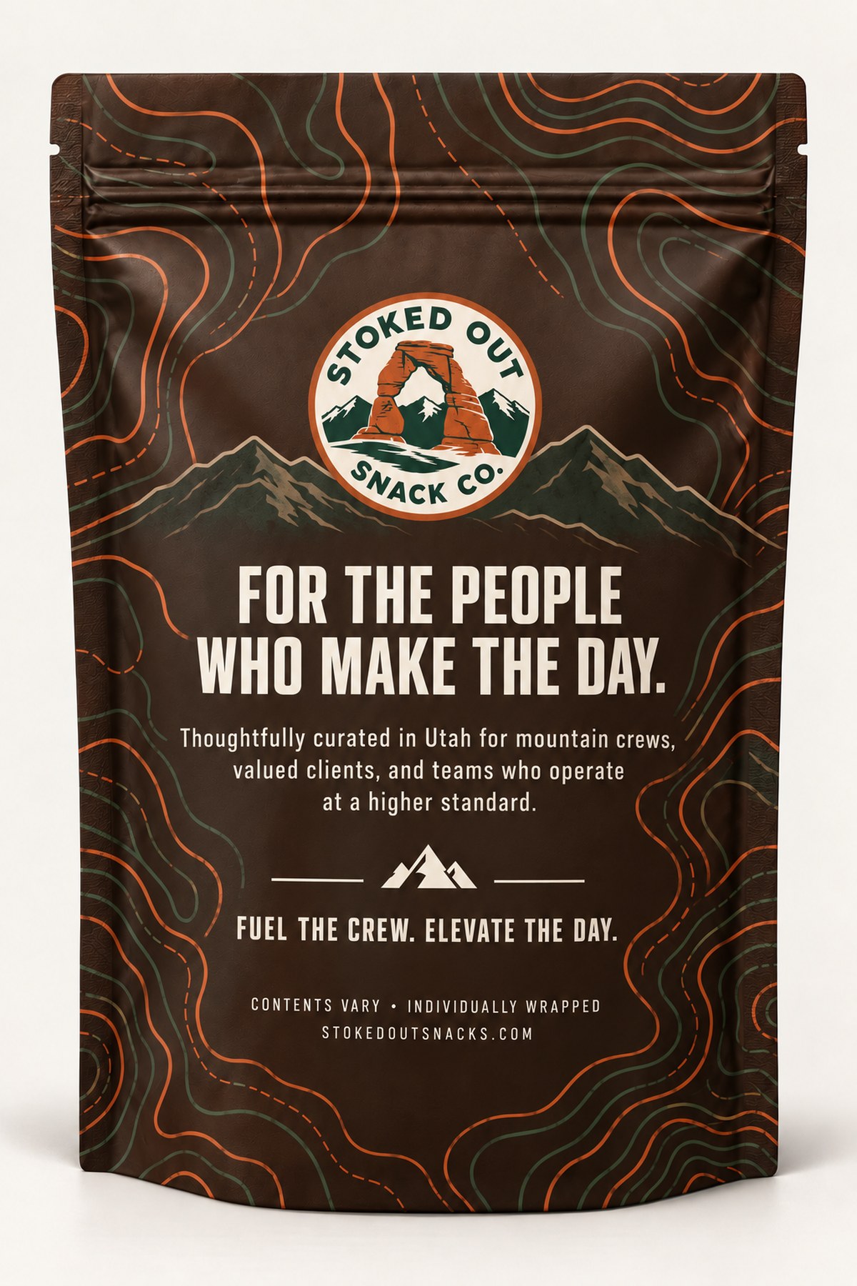 The Stoked Out soft pack bag — espresso-brown kraft pouch with topographic contour print